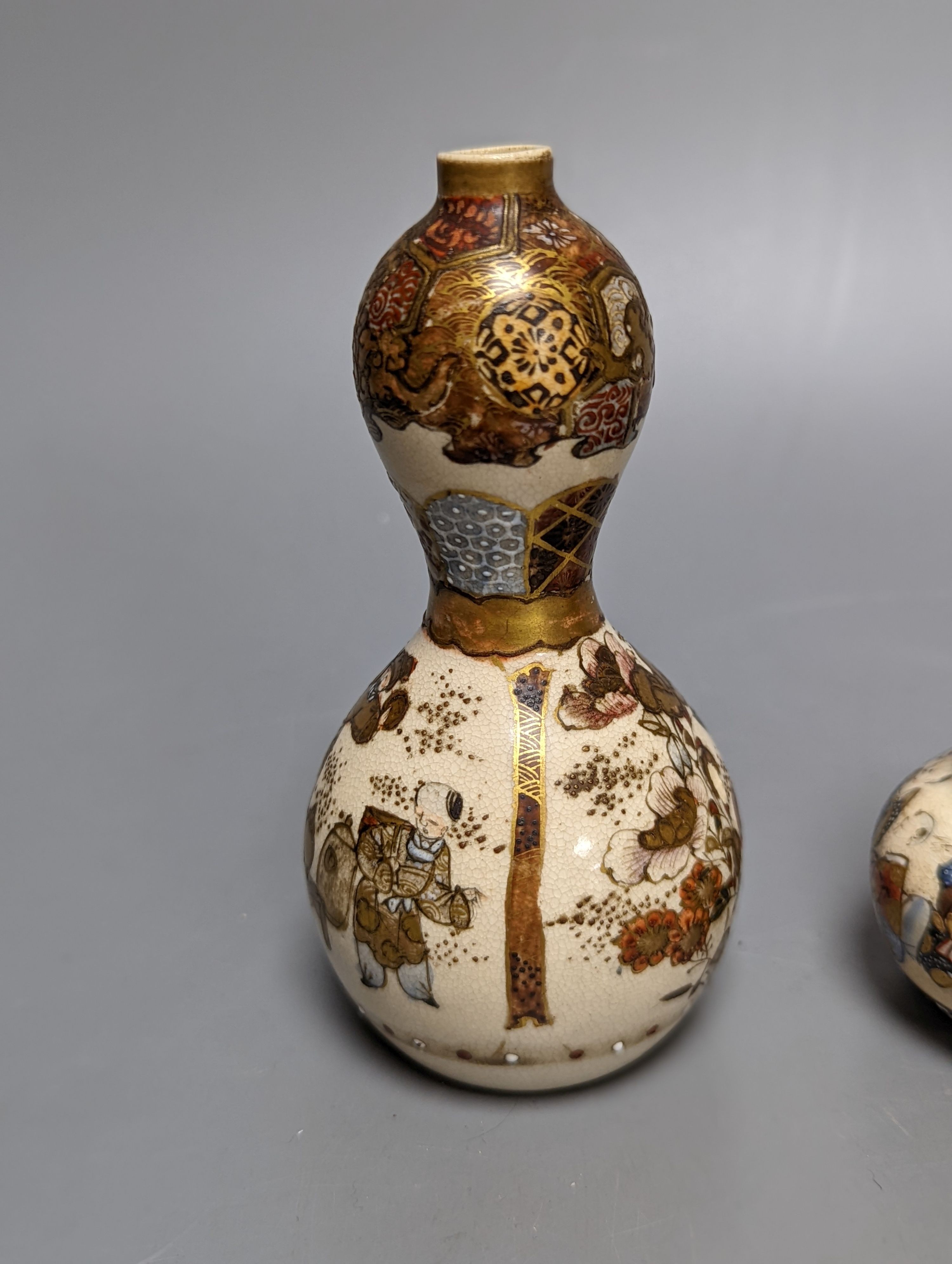 Three Japanese graduated porcelain miniature bowls, a pair of small Satsuma vases and another, pair of vases 12 cms high (6)